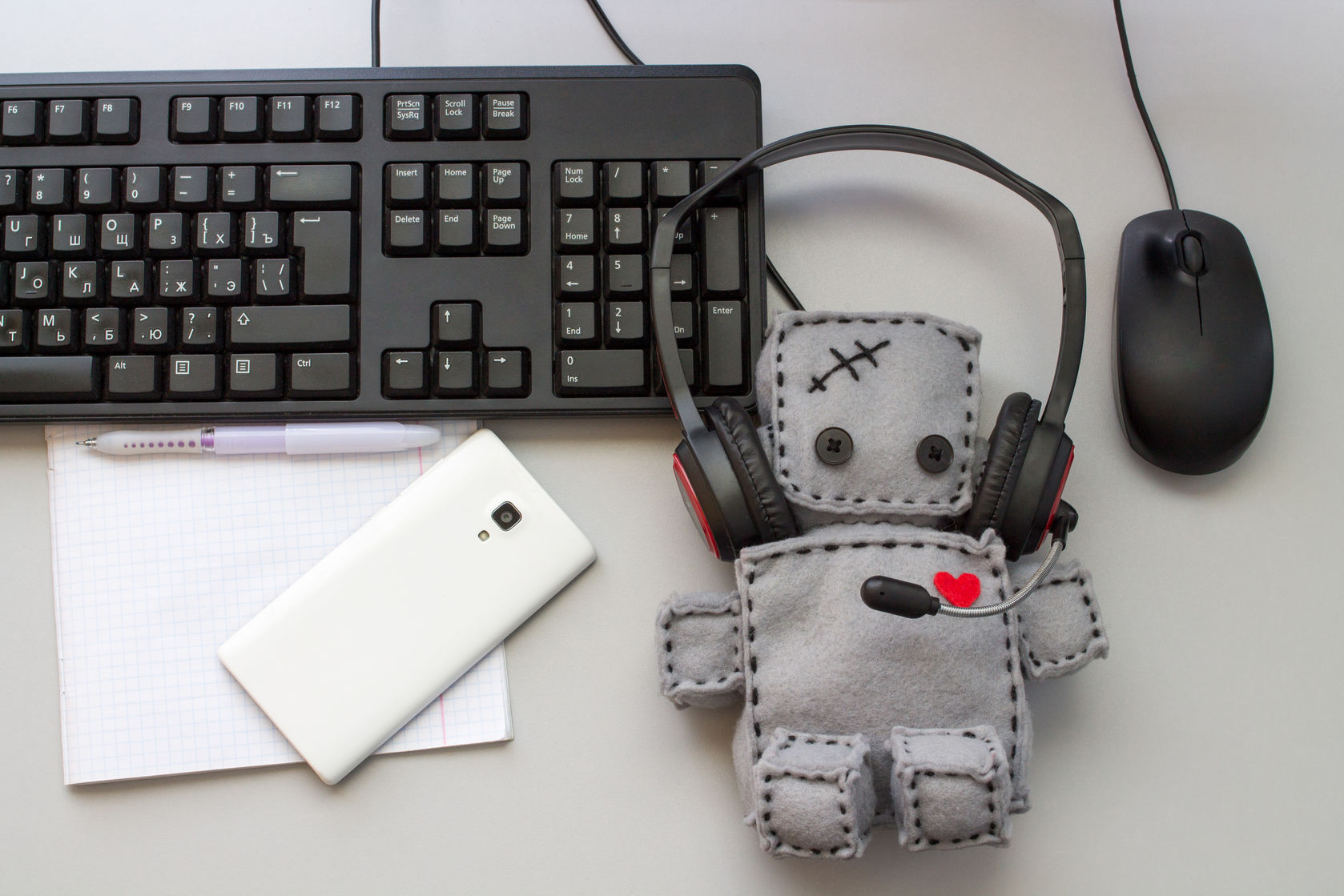 Soft Robot Toy work at Helpdesk. Flat Lay