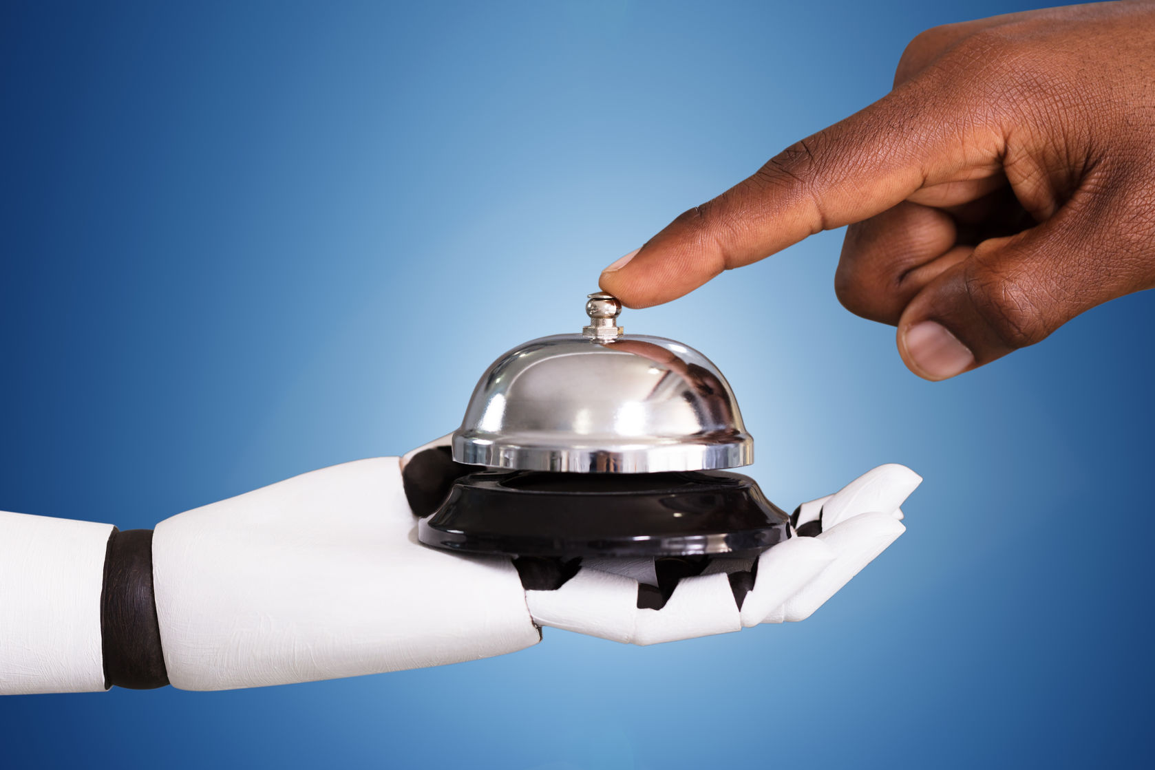 Person Ringing Service Bell Hold By Robot Close-up Of A Person Ringing Service Bell Hold By Robot Against Blue Background