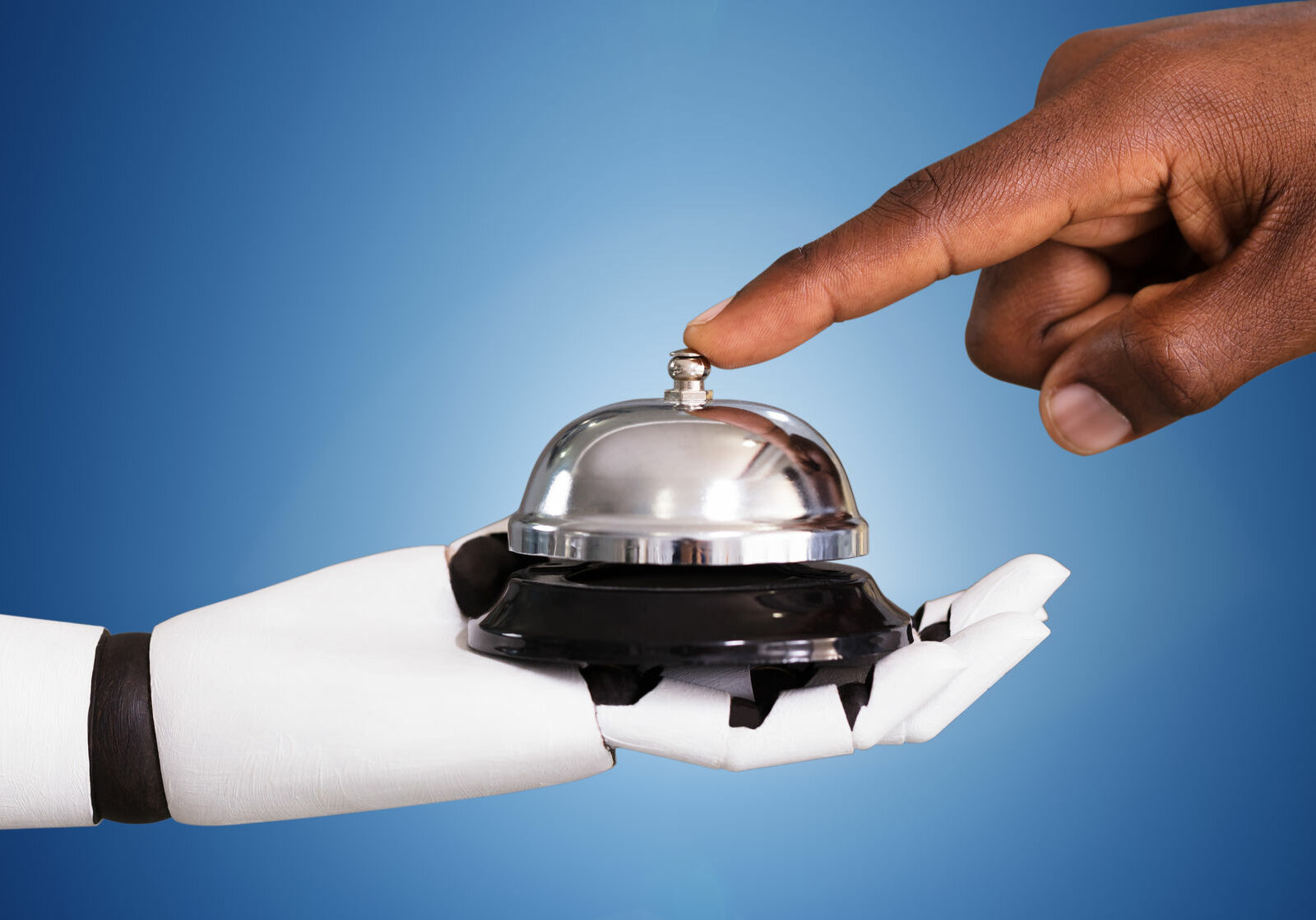 Person Ringing Service Bell Hold By Robot Close-up Of A Person Ringing Service Bell Hold By Robot Against Blue Background